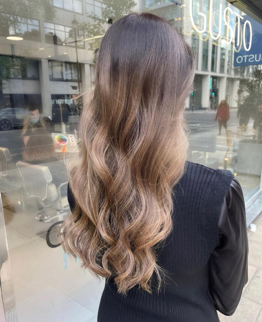 Candlelit brunette hair showing healthy shine at Gusto Hair London