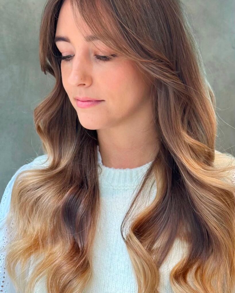 soft caramel highlights on long layered ladies hair at gusto hair salons central london