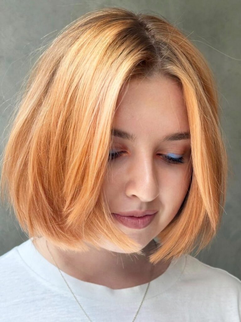 Glossy healthy hair with balayage highlights showing excellent condition at Gusto Hair