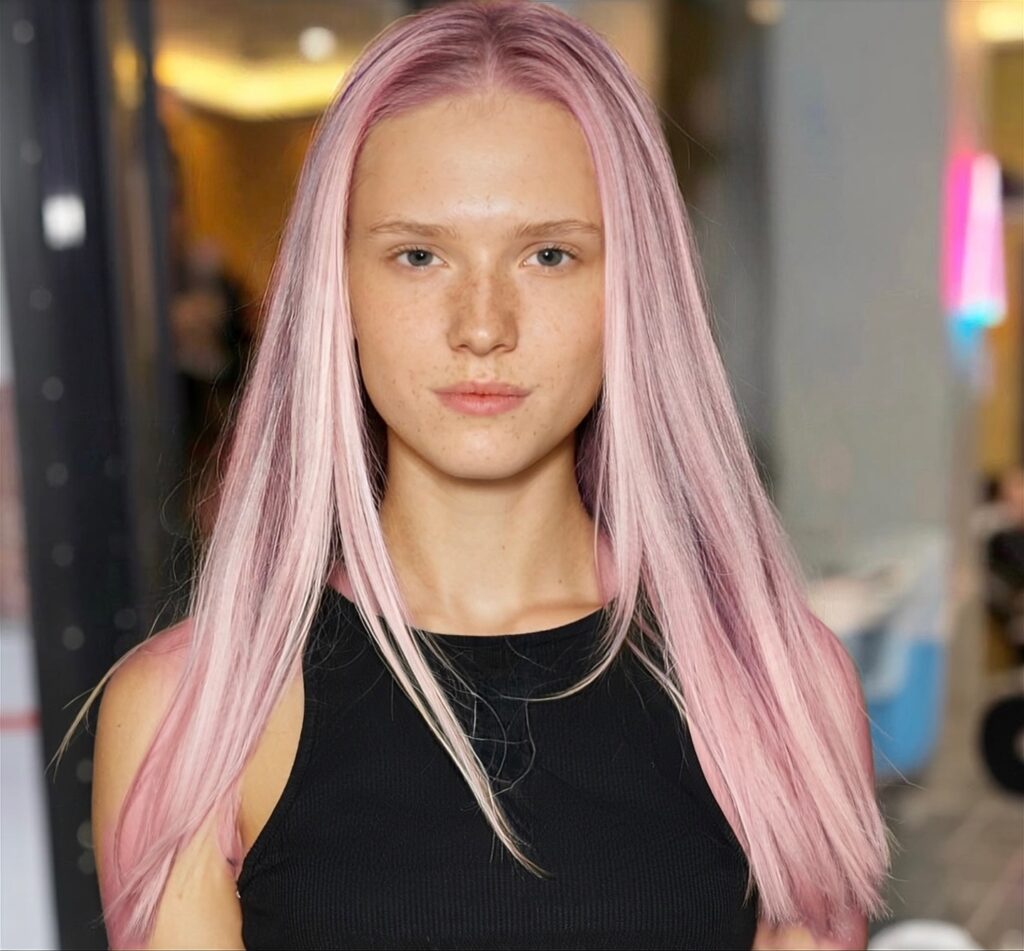 Pastel pink face-framing colour on long straight hair at Gusto Hair London