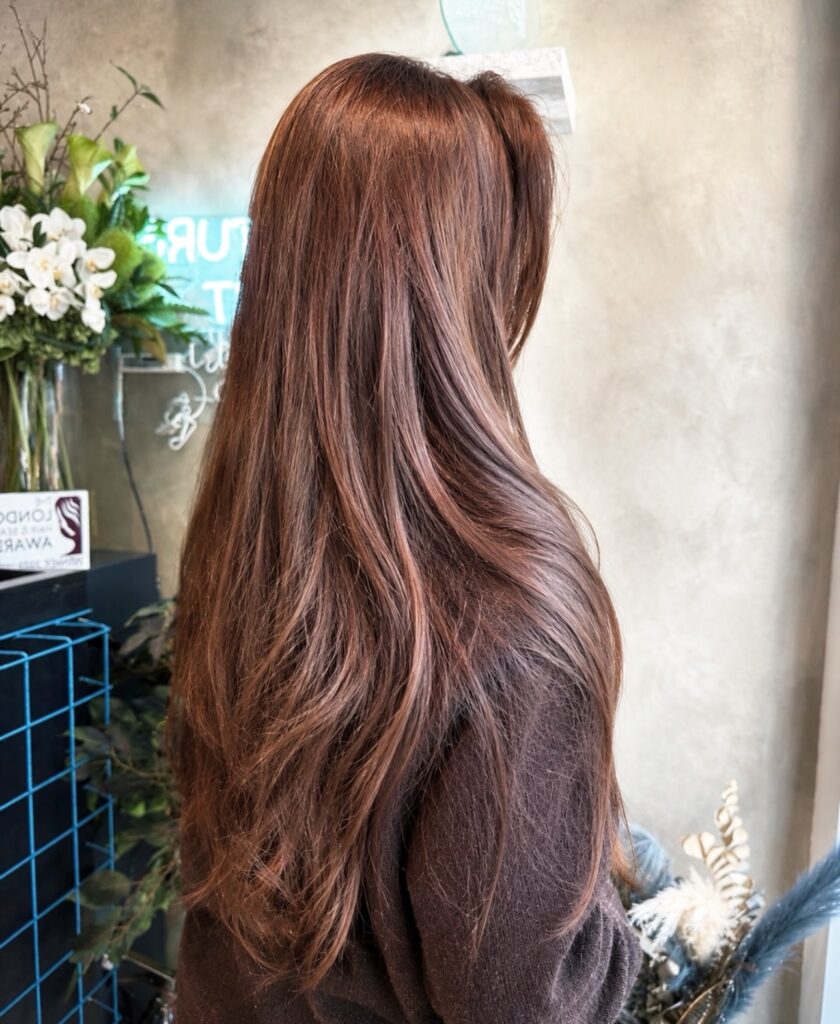Long, strengthened-looking hair styled after a rice water rinse