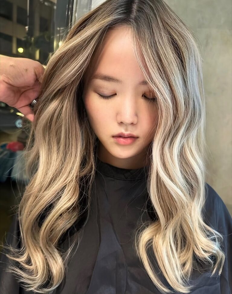 Blonde balayage with a bright face-framing money piece on long waves at Gusto Hair, Covent Garden and Oxford Street