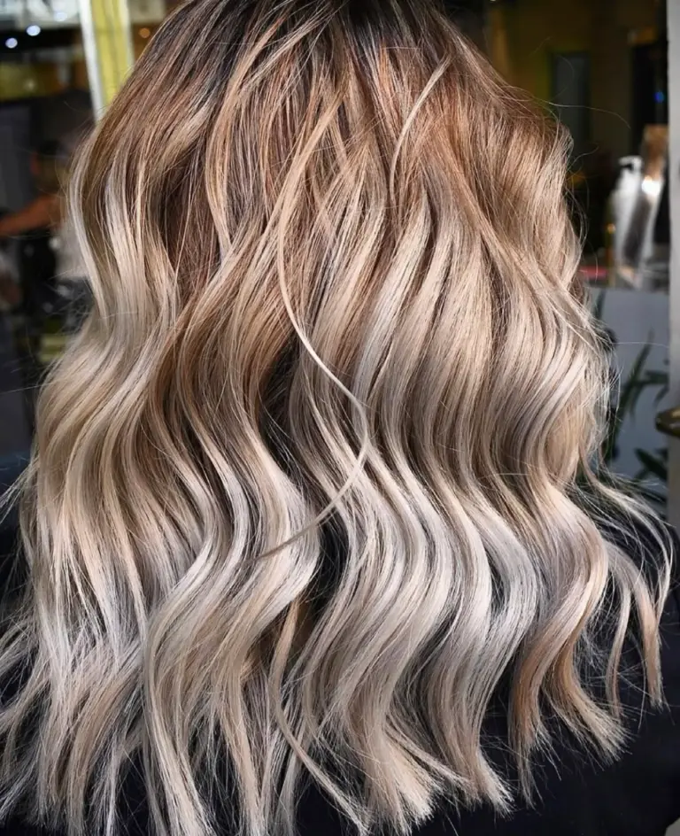 Ash blonde balayage on textured waves at Gusto Hair London