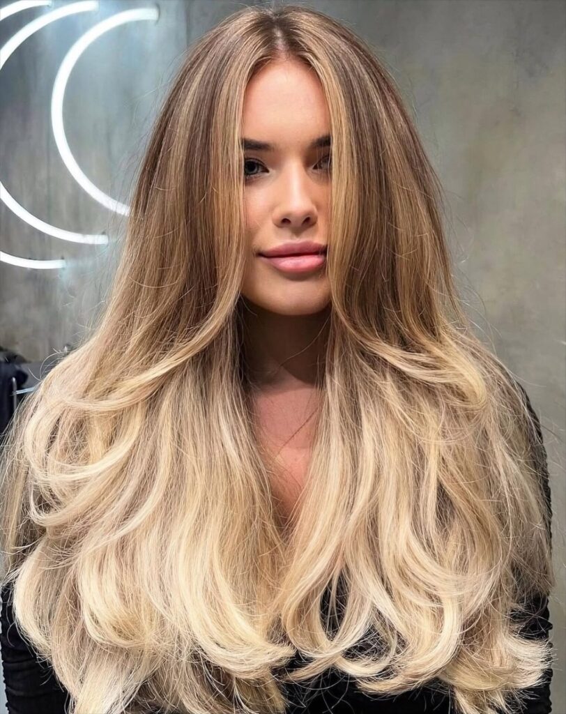 Bronde balayage blending to creamy blonde on long layers at Gusto Hair London