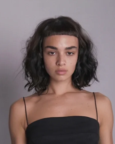 Curly bob with a micro fringe, cut at Gusto Hair London
