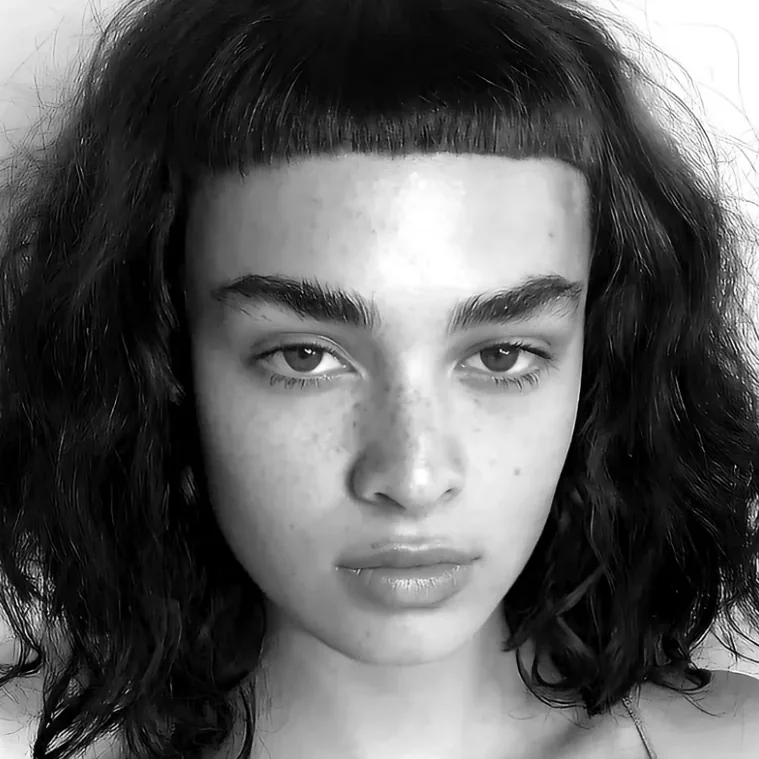 Black and white portrait of a curly bob with a blunt micro fringe, Gusto Hair London