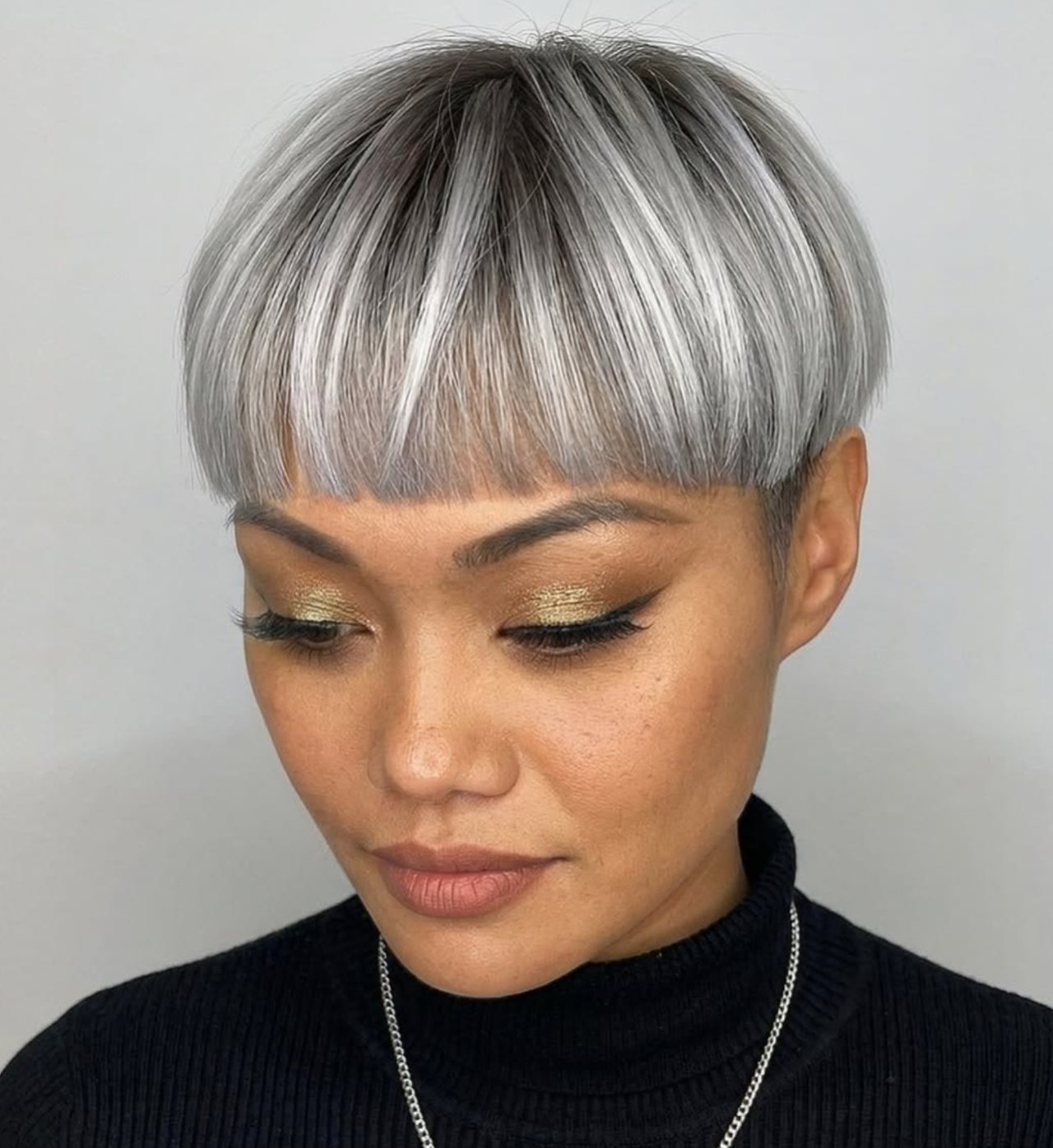Silver grey bowl cut with shadow root and fringe at Gusto Hair London