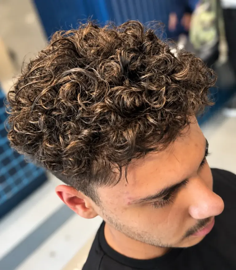 After: defined curly perm with a skin fade on the same gents client at Gusto Hair, London